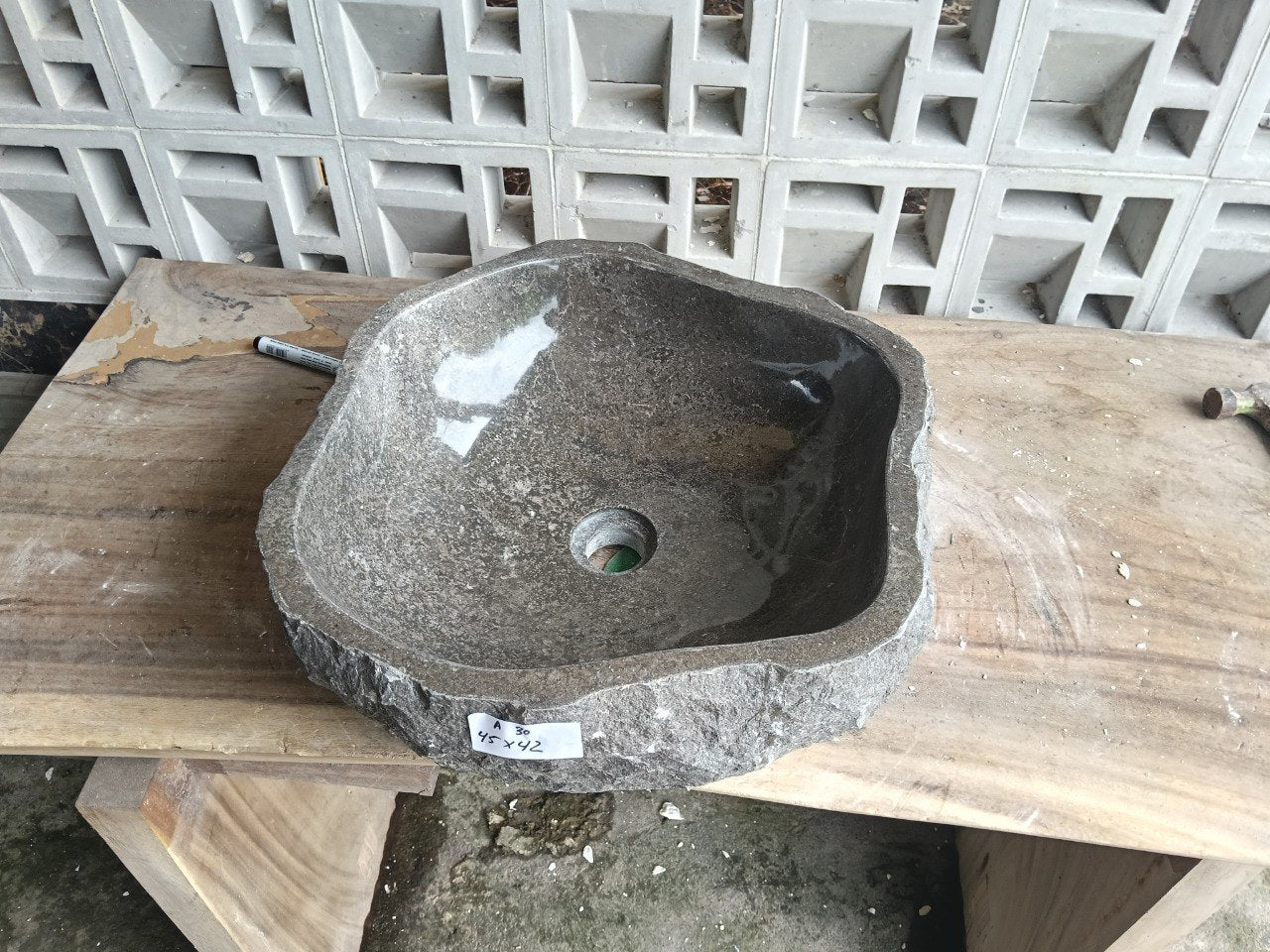 Top view of A30-4542 brown–taupe marble sink with polished interior and rough natural exterior, organic polygonal-oval shape.
