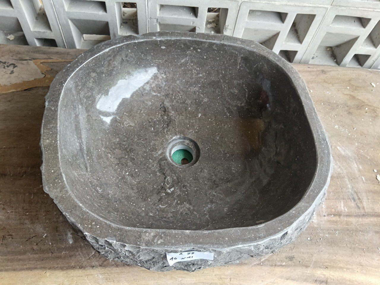 Top view of A33-4641 dark taupe–brown marble sink with polished interior and rough natural exterior, organic rectangular-oval shape.
