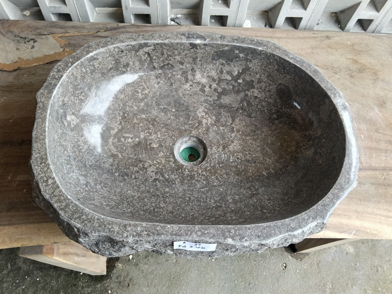 Top view of A37-5640 brown–gray marble sink with polished interior and rough natural exterior, elongated organic oval shape.
