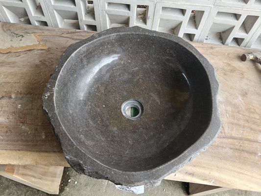 Top view of A45-4545 dark brown marble sink with polished interior and rough natural exterior, organic round shape.
