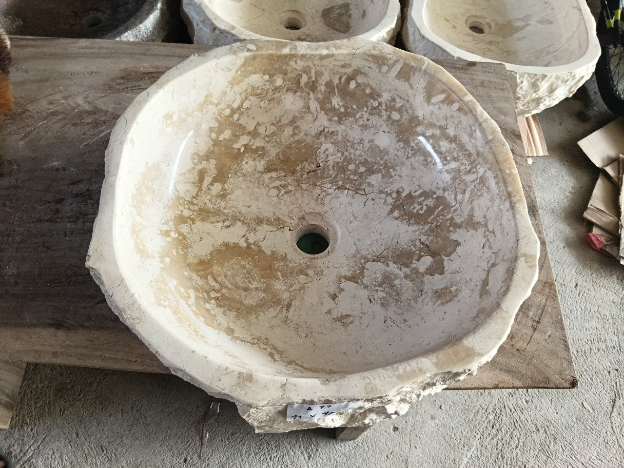 Top view of A77-4445 beige–brown marble sink with polished interior and rough natural exterior, organic round-oval shape.
