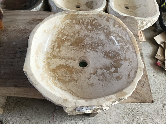 Top view of A77-4445 beige–brown marble sink with polished interior and rough natural exterior, organic round-oval shape.
