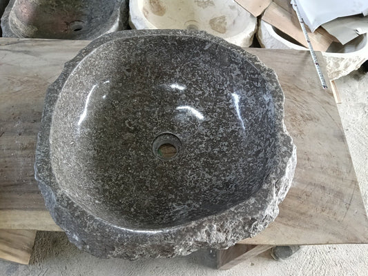 Top view of A84-4545 dark brown-gray marble sink with polished interior and rough natural exterior, organic round shape.
