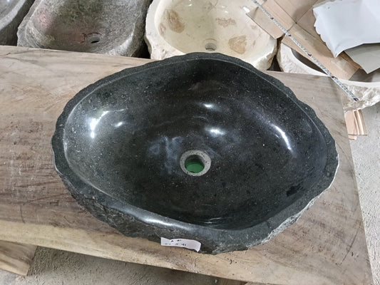 Top view of A91-5141 black andesite stone sink with polished interior and rough chiseled exterior, organic irregular shape.
