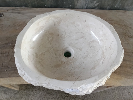Top view of A108-5043 white marble sink with polished interior and rough natural exterior, organic round-oval shape.

