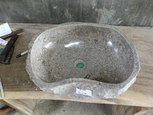Top view of A114-5240 beige marble sink with polished interior and exterior, organic oval irregular shape.

