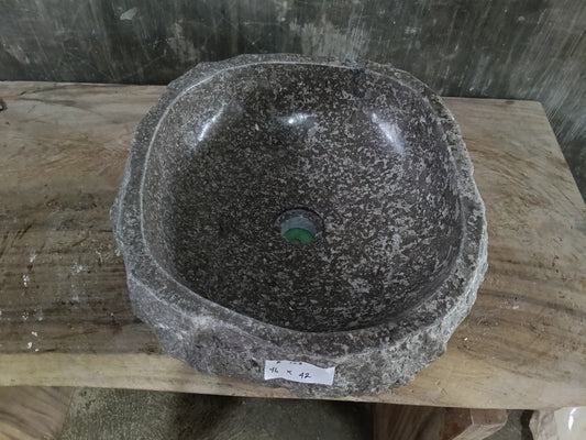Top view of A123-4642 polished dark marble sink with speckled texture, organic round-oval shape.
