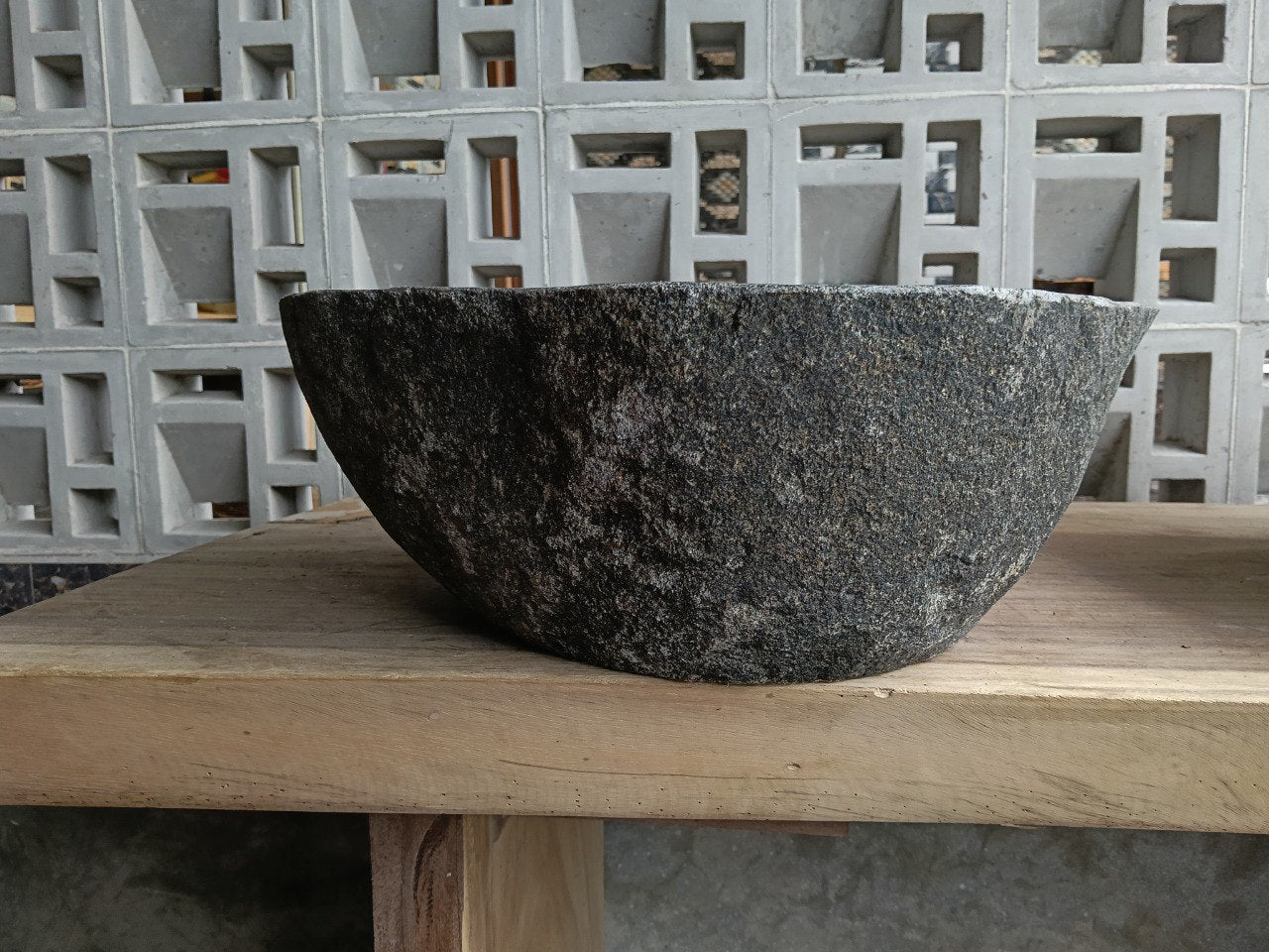 Back view of 6705-4336 handcrafted stone bathroom basin with raw textured exterior
