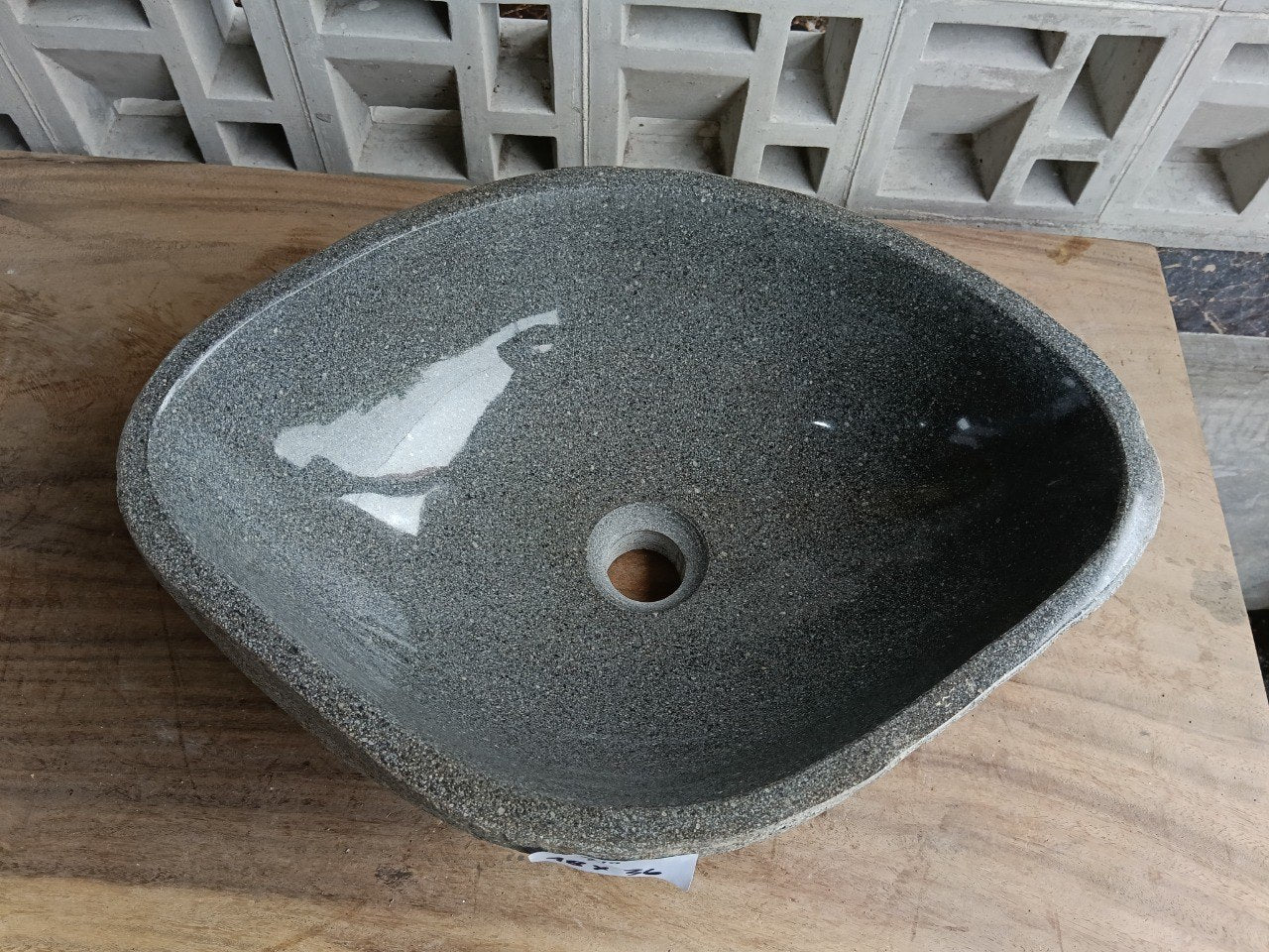 Top view of 6710-4836 graphite river stone sink, polished rounded oval interior
