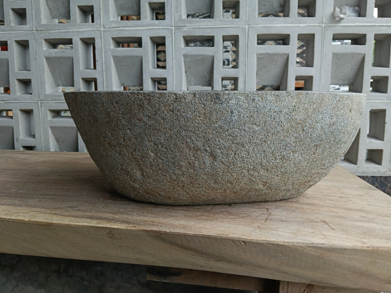 Back view of 6710-4836 handcrafted stone bathroom basin with raw textured exterior
