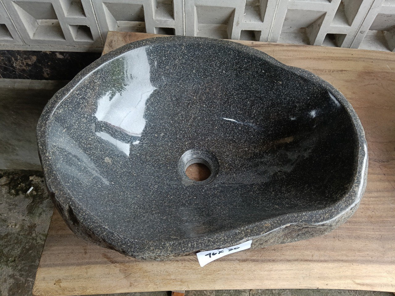 Top view of 6715-4636 graphite river stone sink, polished elongated oval interior
