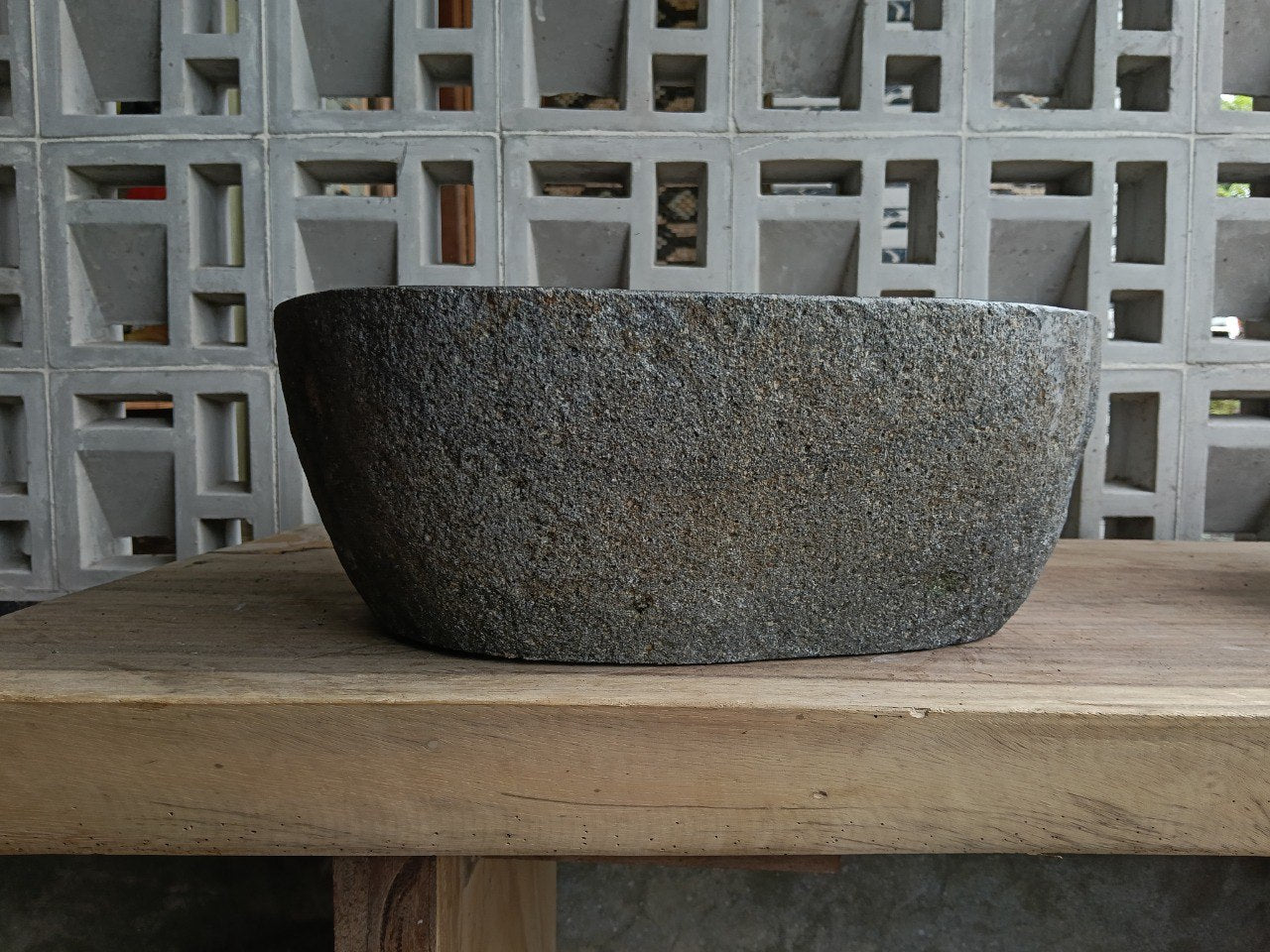 Back view of 6720-4134 handcrafted stone bathroom basin with raw textured exterior
