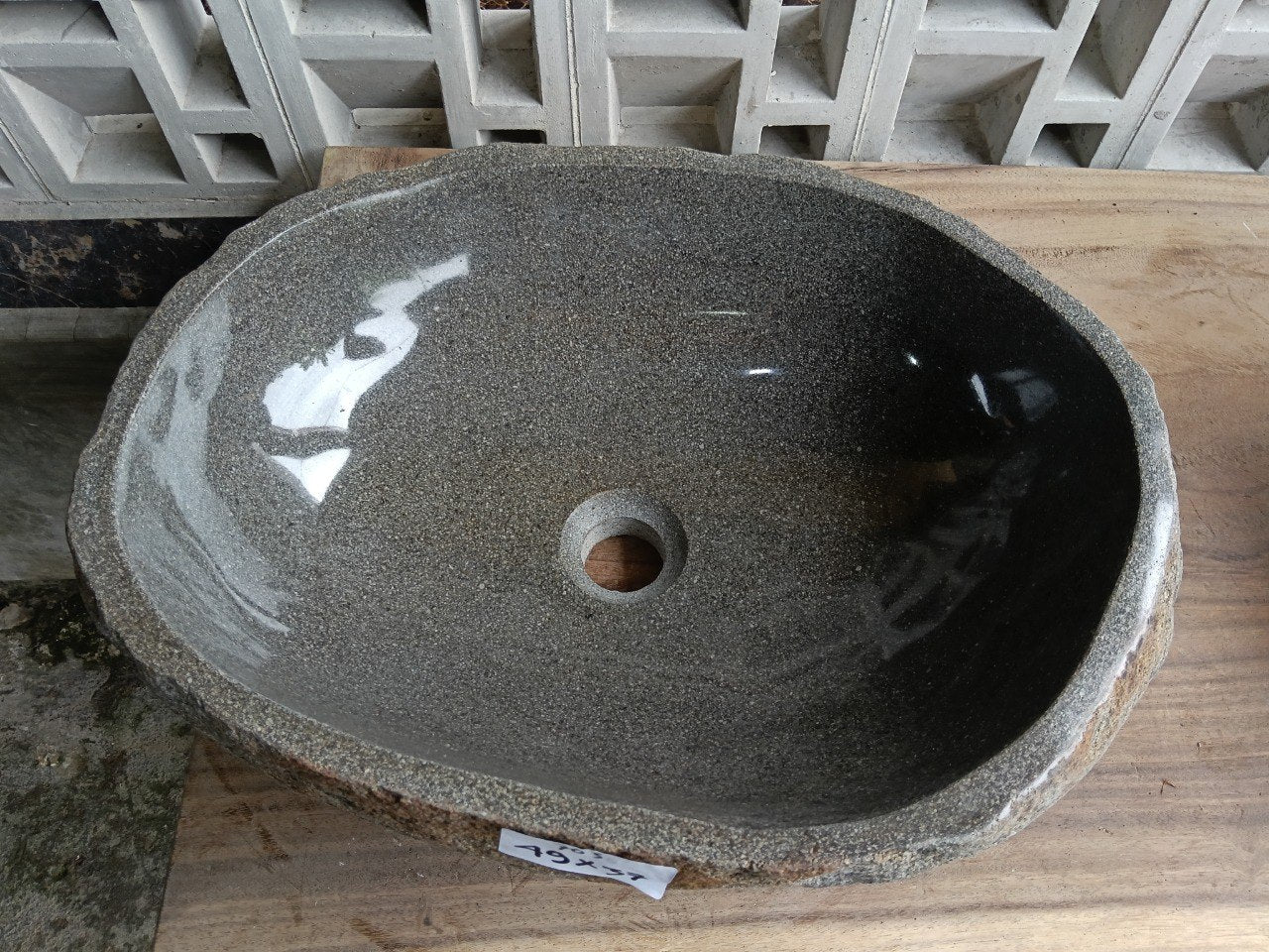 Top view of 6703-4937 graphite river stone sink, polished elongated oval interior
