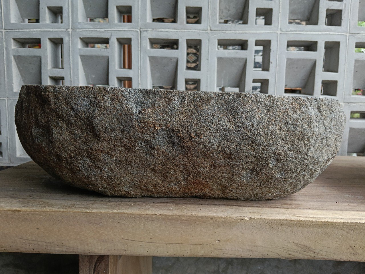 Back view of 6703-4937 handcrafted stone bathroom basin with raw textured exterior
