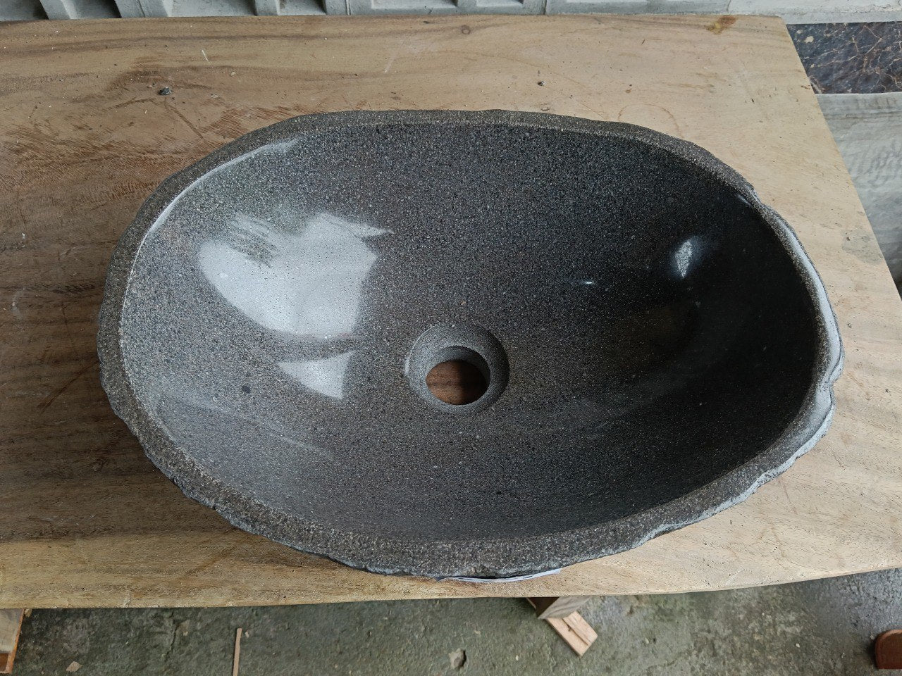Top view of 6767-4029 deep graphite river stone sink, polished oval interior
