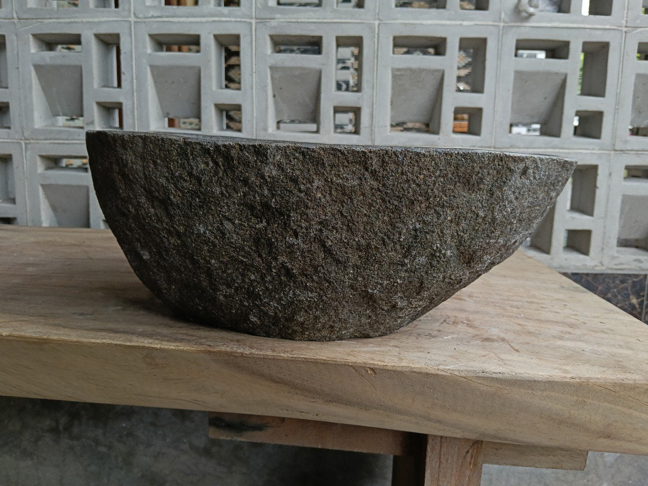 Back view of 6767-4029 handcrafted stone bathroom basin with raw textured exterior
