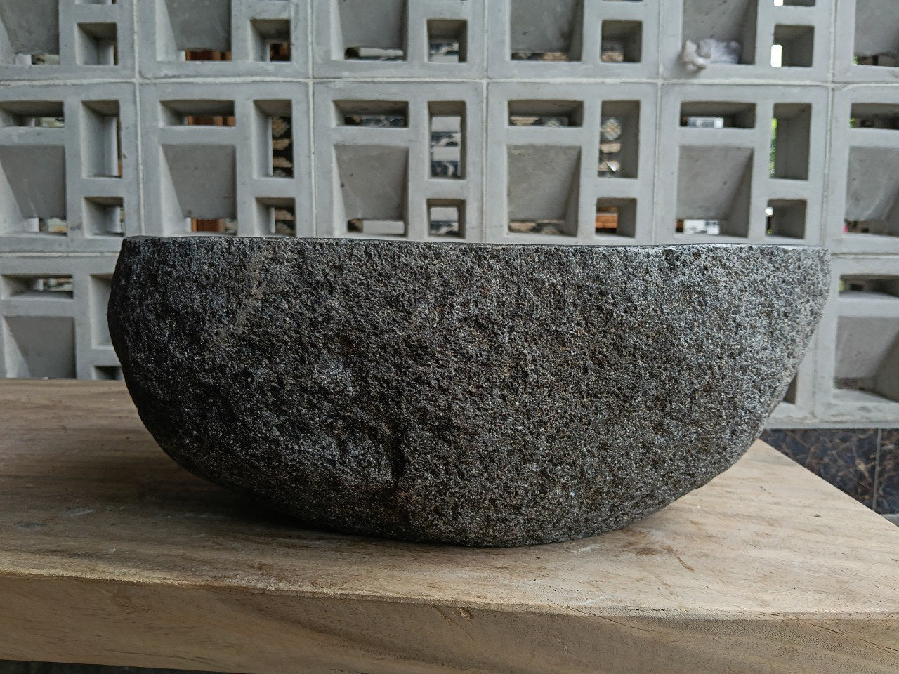 Back view of 6761-4029 handcrafted stone bathroom basin with raw textured exterior
