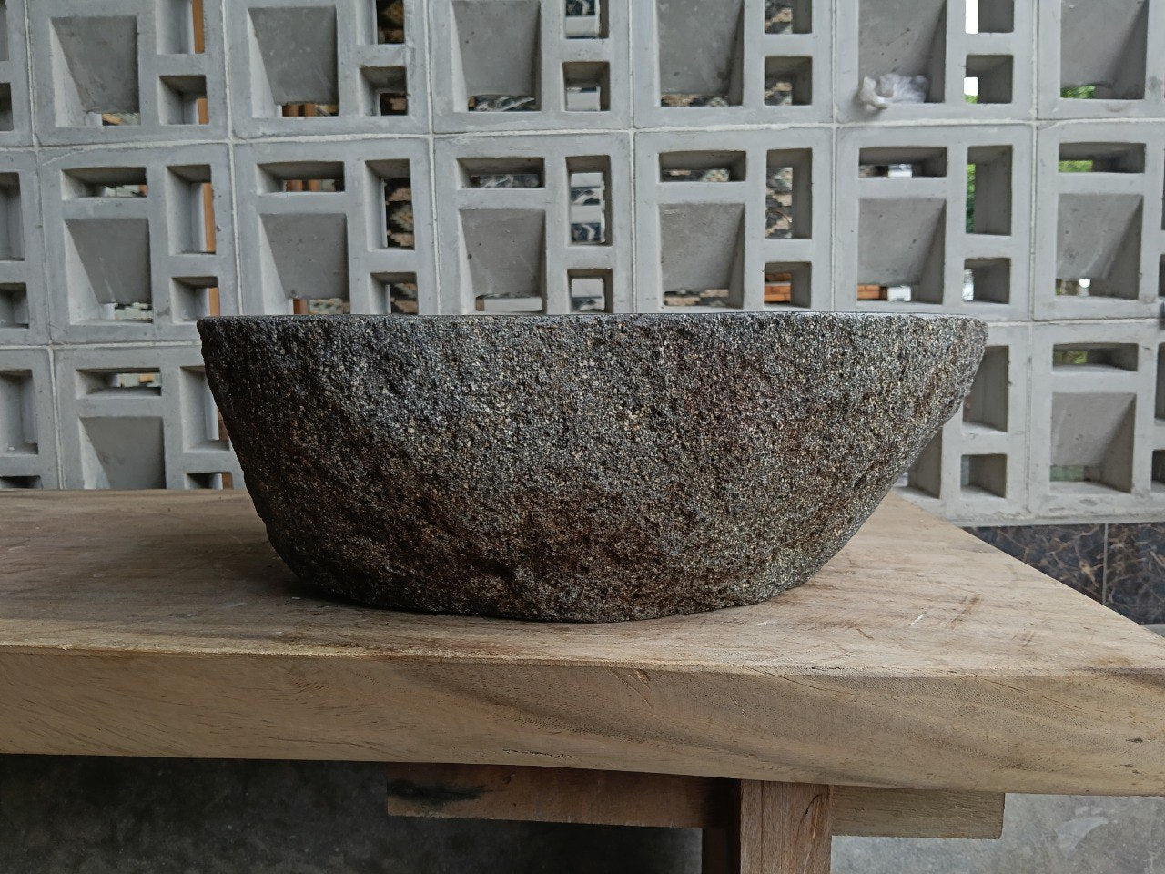 Back view of 6785-4734 handcrafted stone bathroom basin with raw exterior texture
