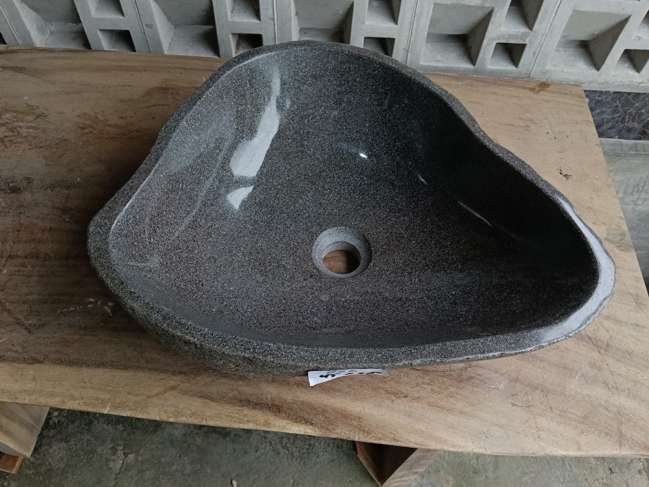 Top view of 6876-4538 triangular river stone sink, polished graphite interior
