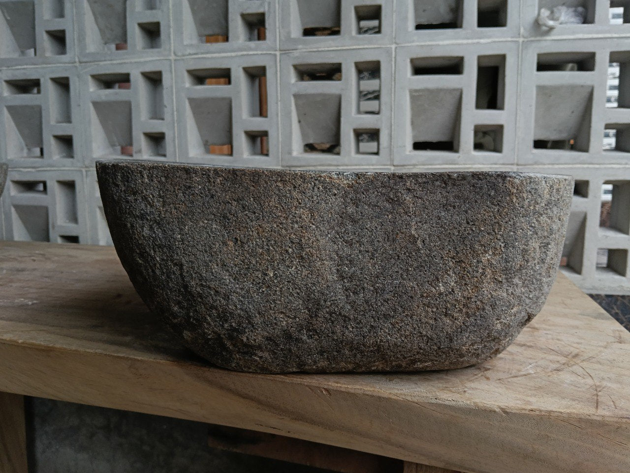 Back view of 6876-4538 handcrafted stone bathroom basin with raw exterior texture
