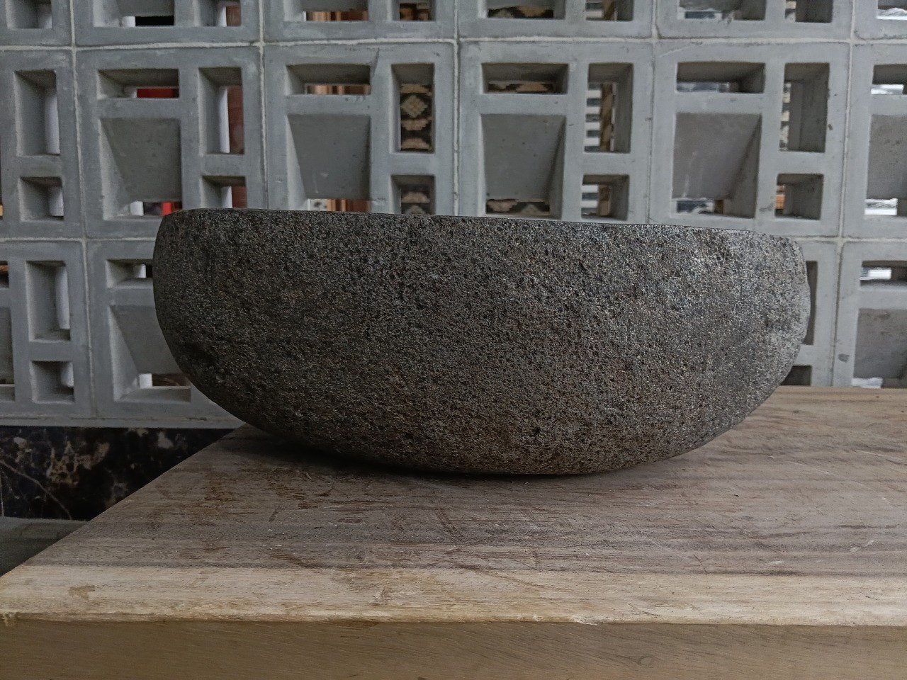 Back view of 6881-4031 handcrafted stone bathroom basin with raw exterior texture
