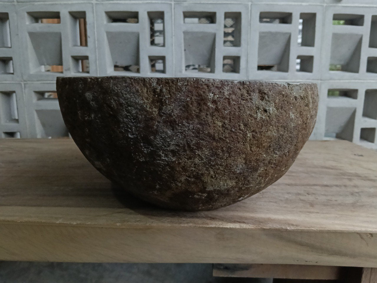 Right side of 6885-4133 natural stone sink, polished bowl and rustic rock surface
