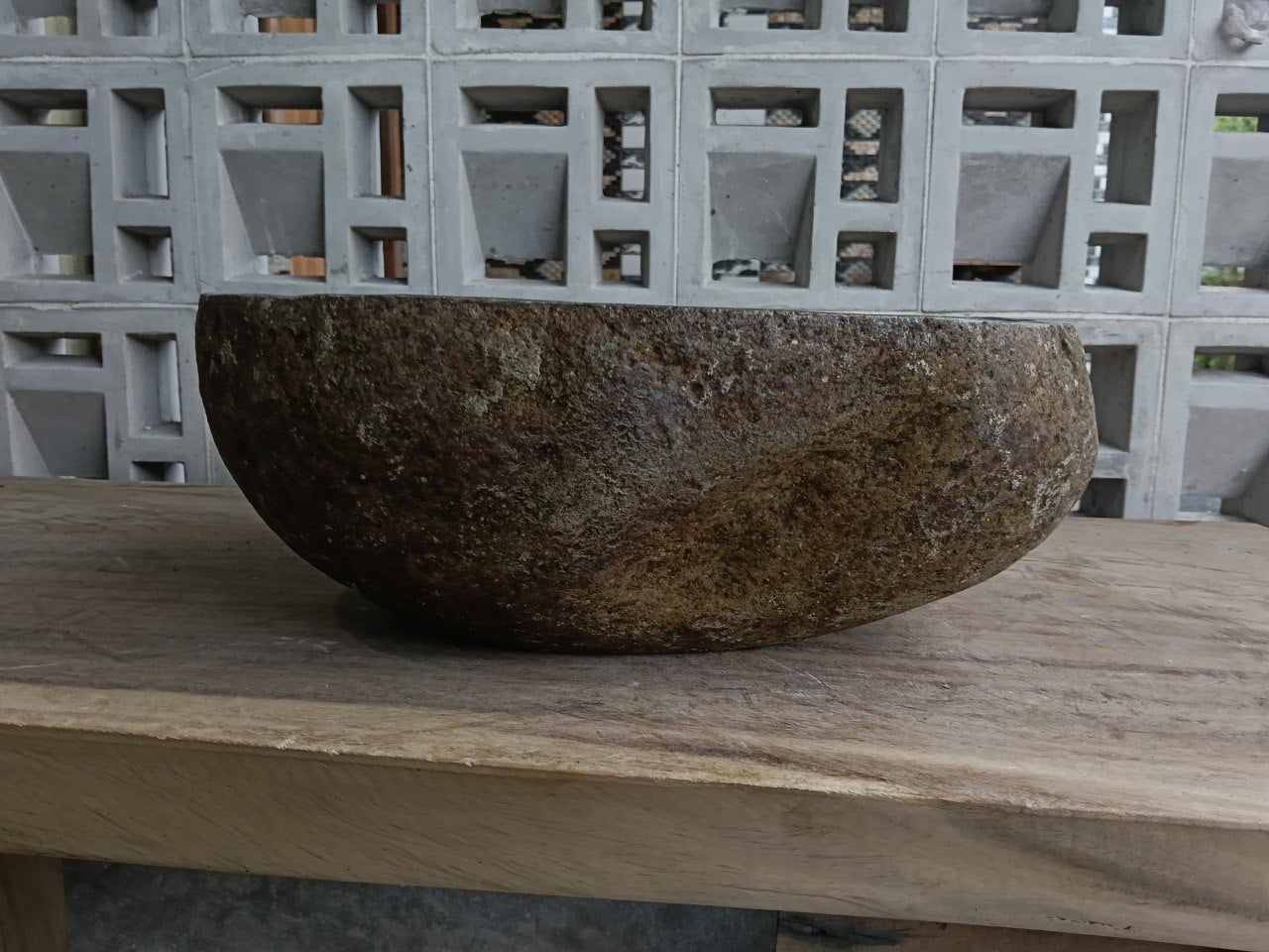 Back view of 6885-4133 handcrafted stone bathroom basin with raw exterior texture
