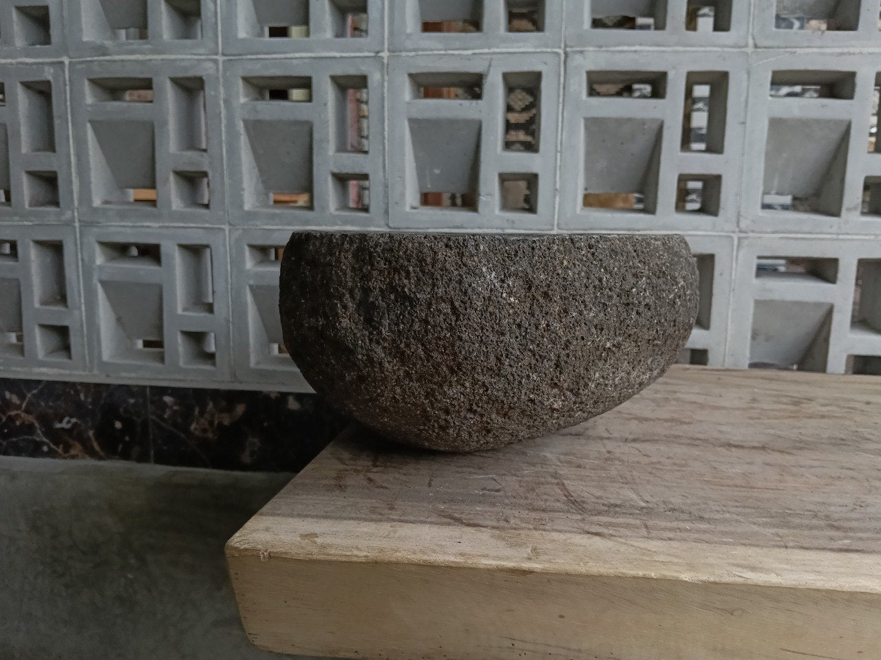 Left side of 6863-4029 river stone vessel sink in chocolate graphite color
