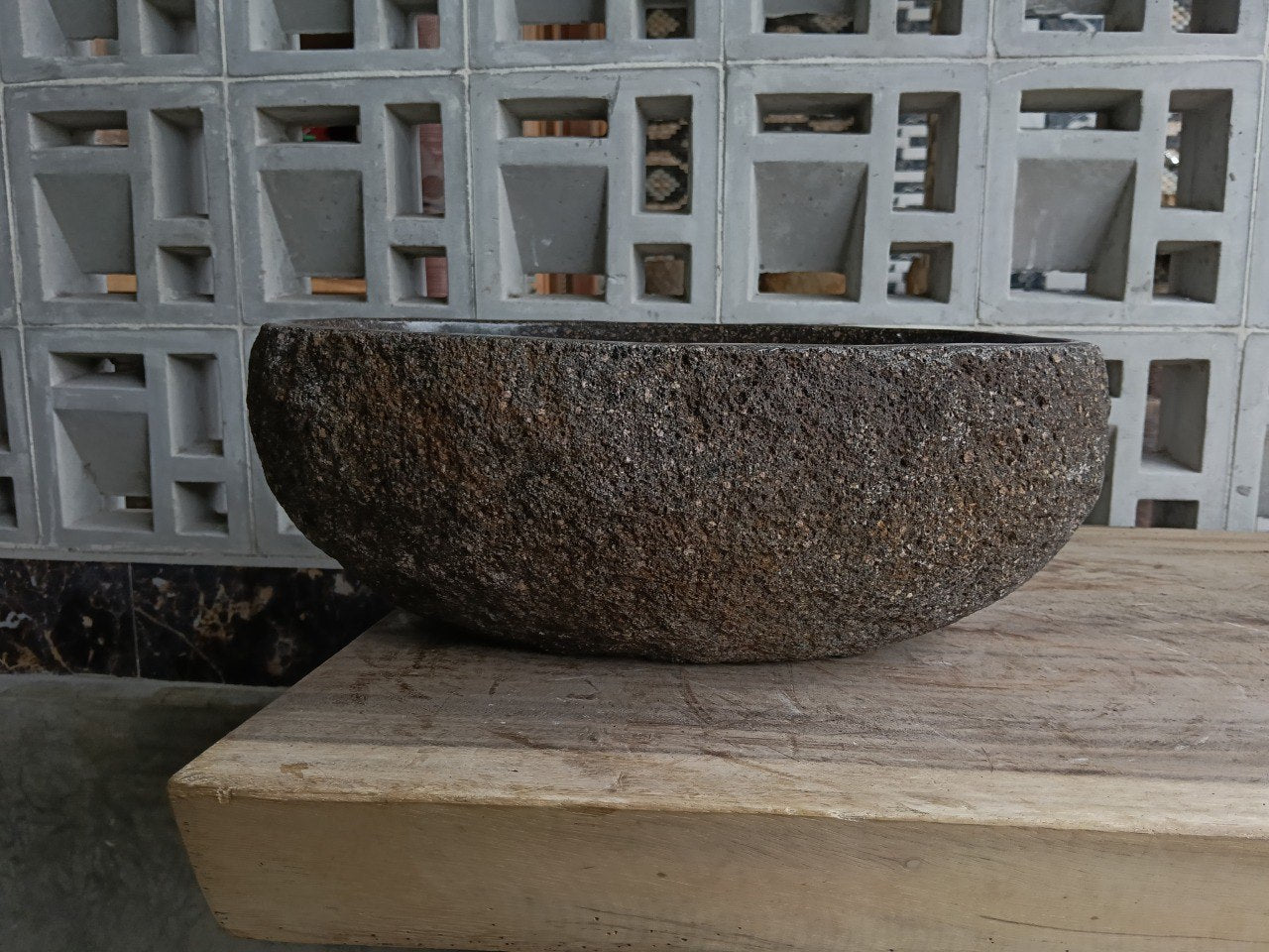 Back view of 6863-4029 handcrafted stone bathroom basin with raw exterior texture
