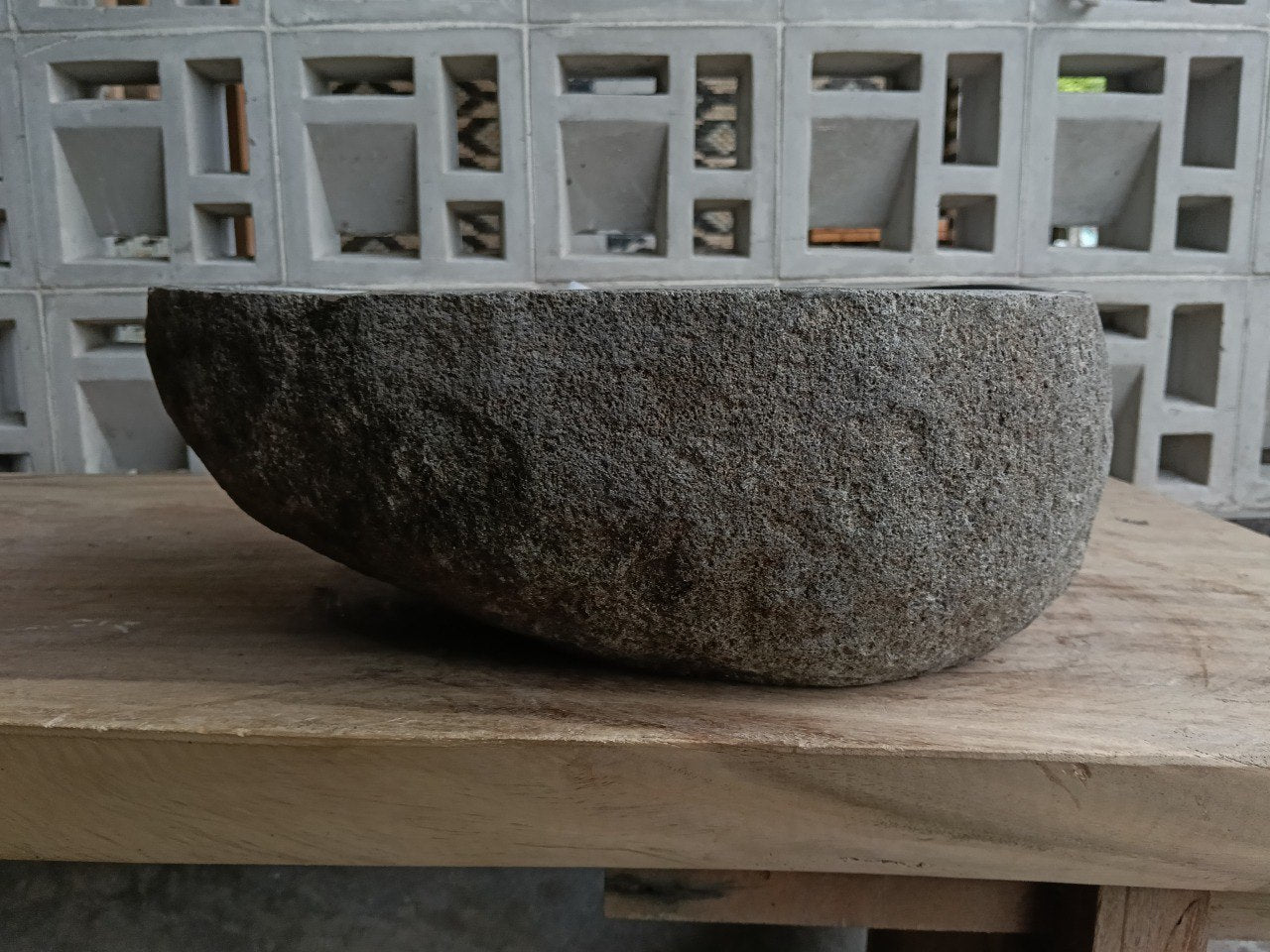 Back view of 6878-4930 handcrafted stone bathroom basin with raw exterior texture
