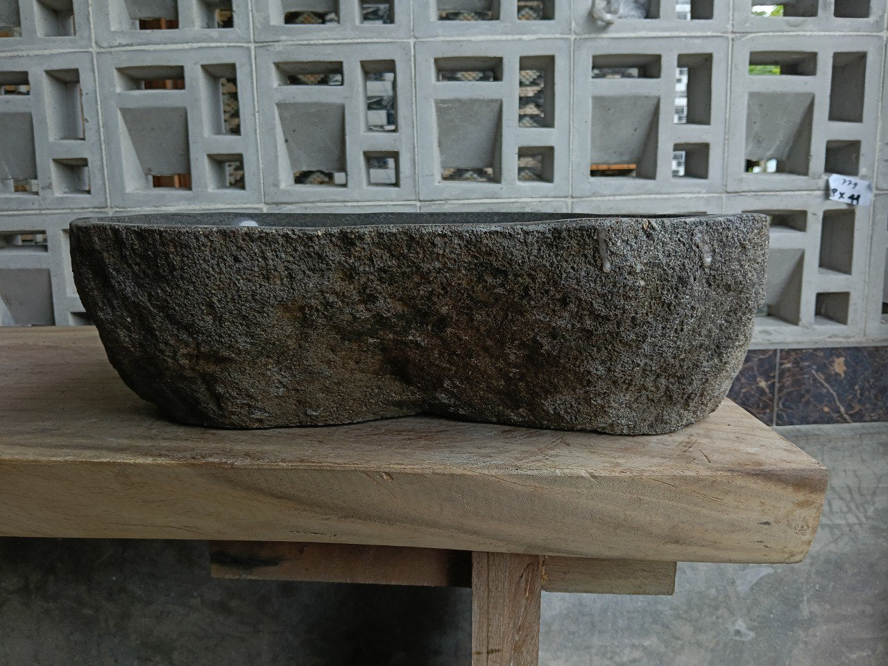 Back view of 6857-4736 handcrafted stone bathroom basin with raw exterior texture
