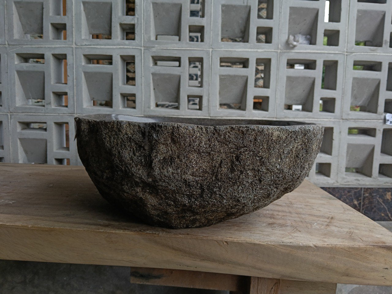 Right side of 6858-4642 river stone sink, polished bowl and rustic rock surface
