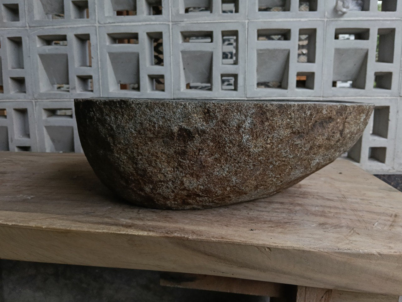 Right side of 6859-4543 river stone sink, polished bowl and rustic outer surface
