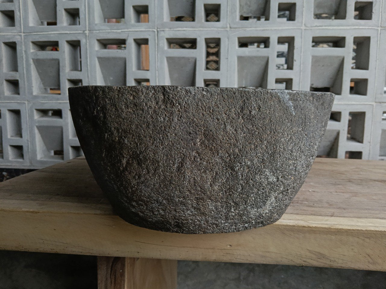 Right side of 6821-4934 natural stone sink, polished bowl and rustic rock surface
