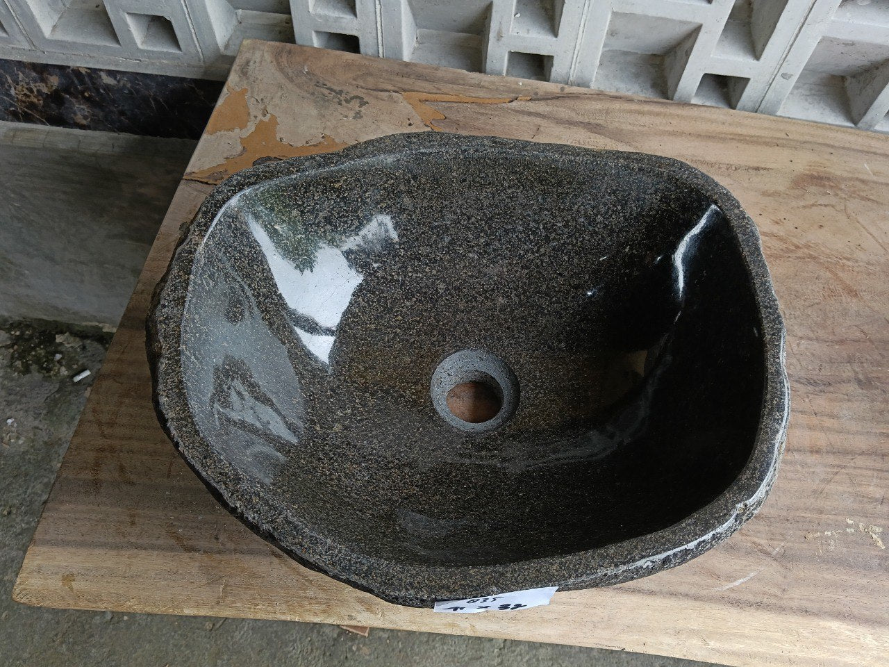 Top view of 6835-4132 dark basalt river stone sink, polished interior
