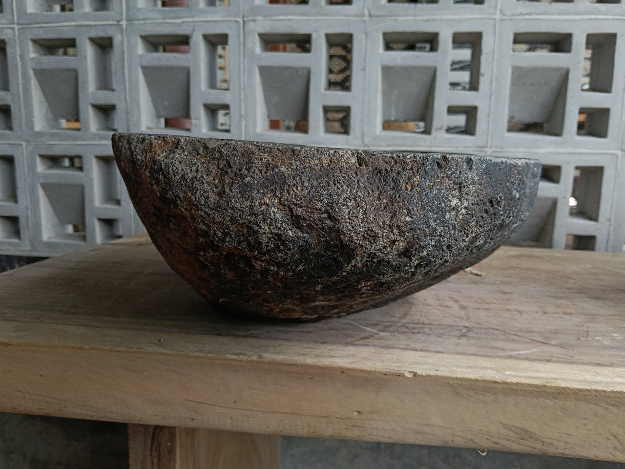 Left side of 6835-4132 dark gray river stone sink with polished bowl
