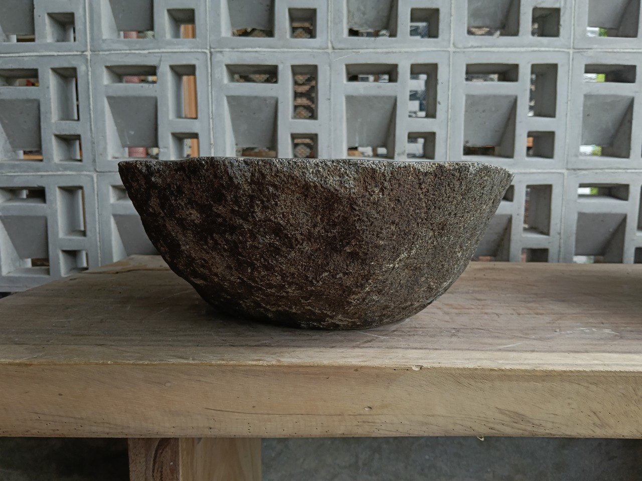 Left side of 6844-4836 river stone vessel sink, warm granite gray color
