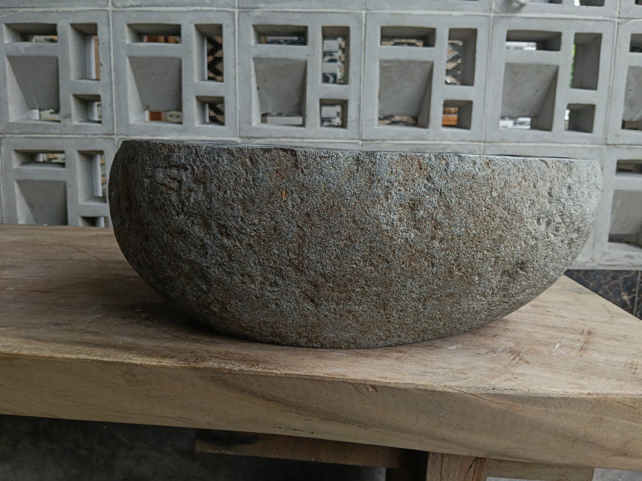 Back view of 6800-4033 handcrafted stone bathroom basin with raw exterior texture
