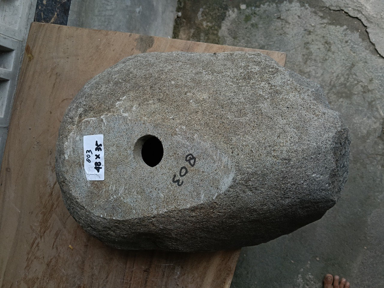 Bottom view of 6803-4835 solid river stone sink — standard drain hole

