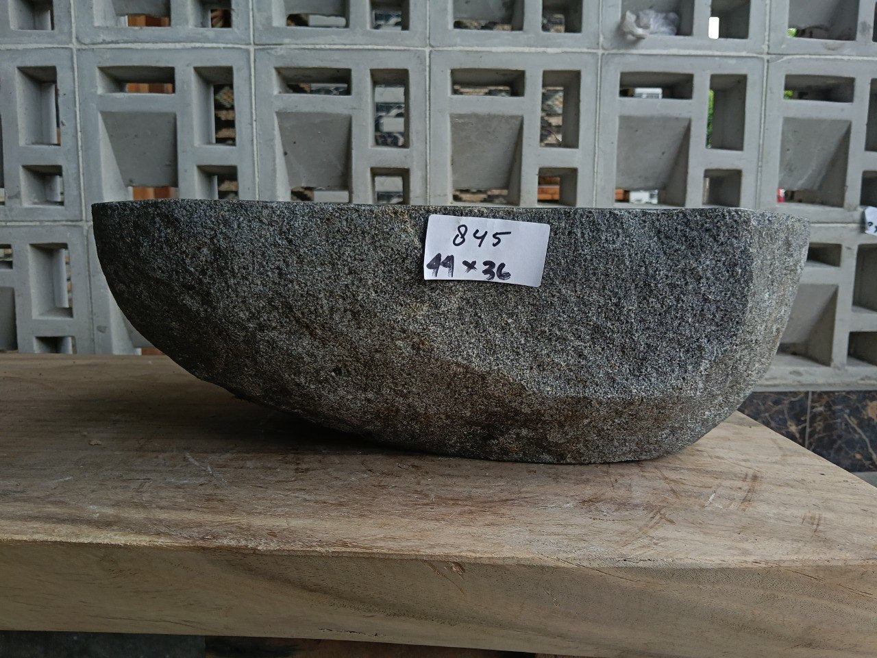 Front view of 6845-4436 river stone vessel — polished interior bowl
