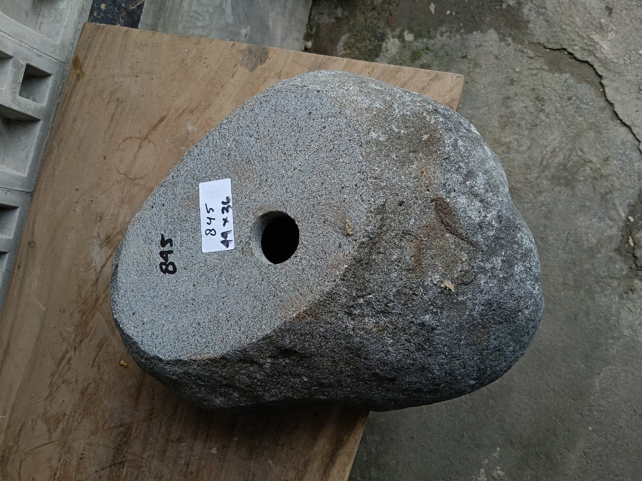 Bottom view of 6845-4436 solid river stone sink — standard drain hole
