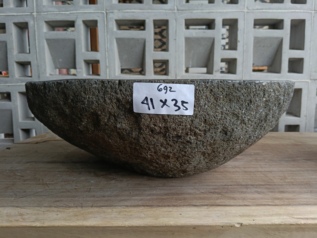 Front view of 6692-4135 river stone vessel — polished interior bowl

