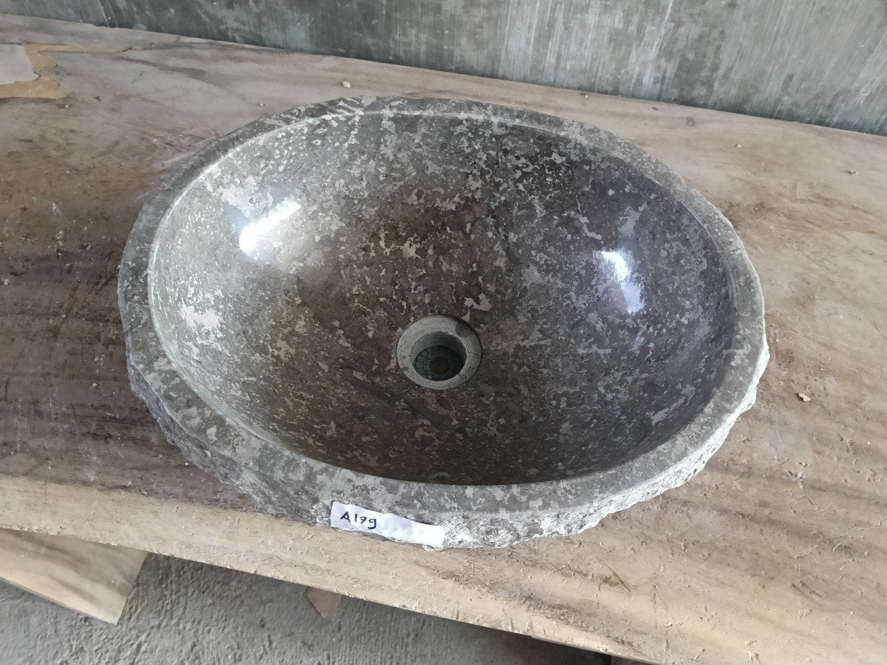 Top view of A179-4232 brown–taupe marble sink with polished interior and rough natural exterior, organic oval shape.
