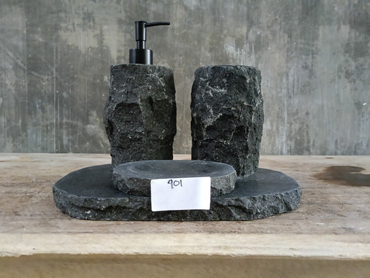 Hand-carved andesite stone bathroom set with dispenser, toothbrush holder, soap dish, and stone tray.

