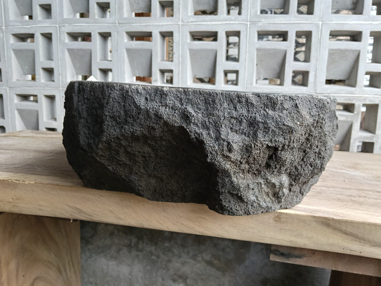 Back view showing split-rock exterior of andesite stone sink

