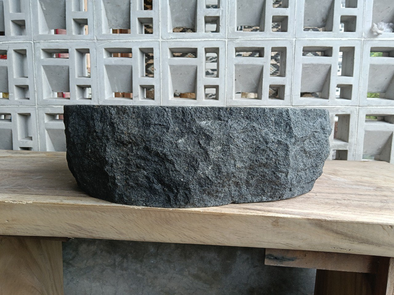 Back view showing split-rock exterior of andesite stone sink
