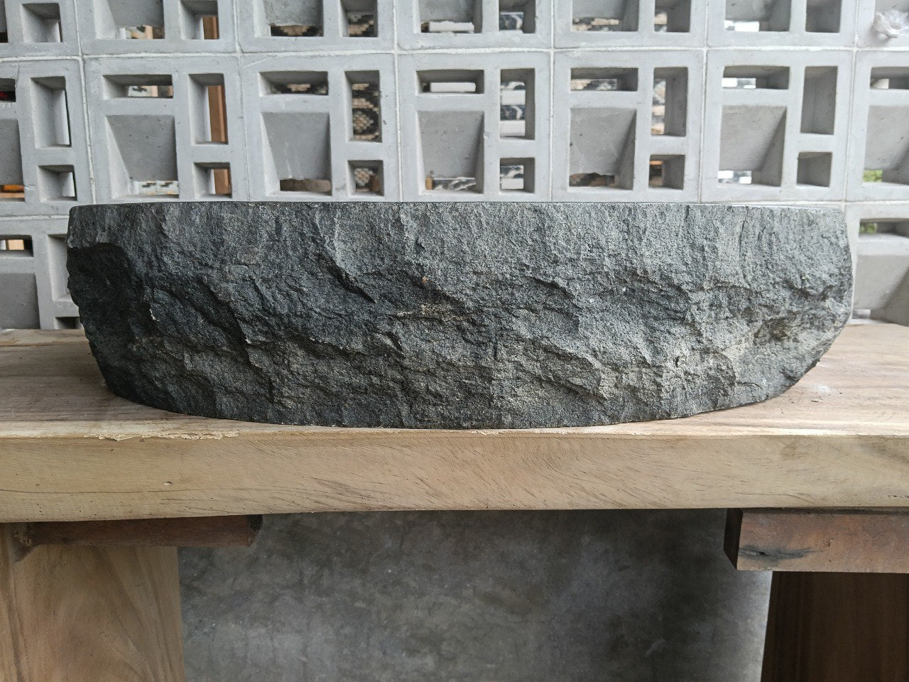 Back view showing split-rock exterior of andesite stone sink
