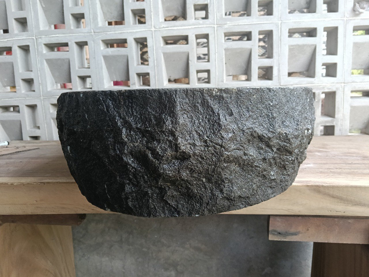 Back view showing split-rock exterior of andesite stone sink
