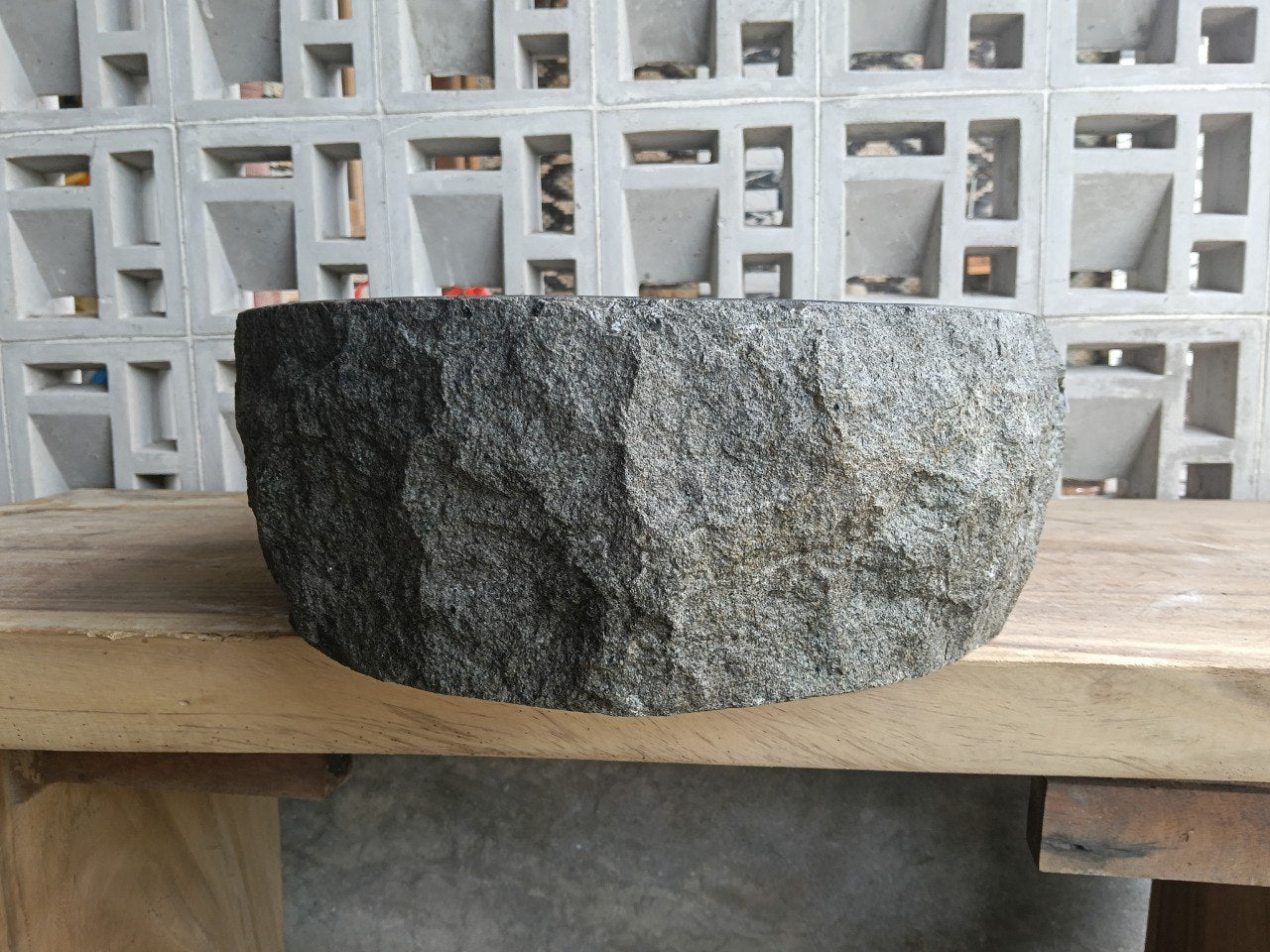 Back view showing split-rock exterior of andesite stone sink
