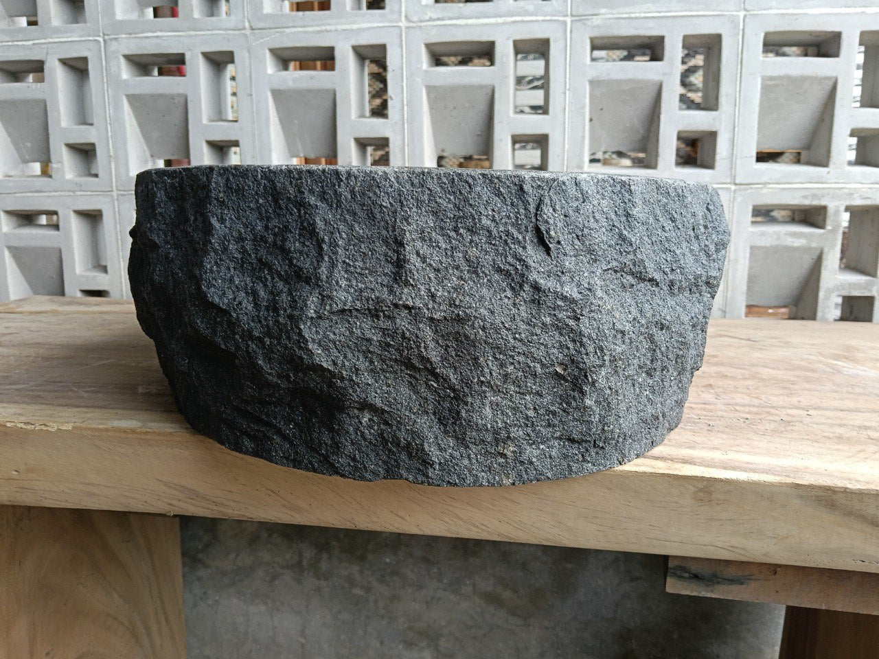 Back view showing split-rock exterior of andesite stone sink
